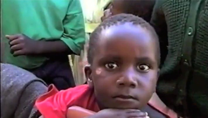 A young child looking at the camera during an outreach in Africa