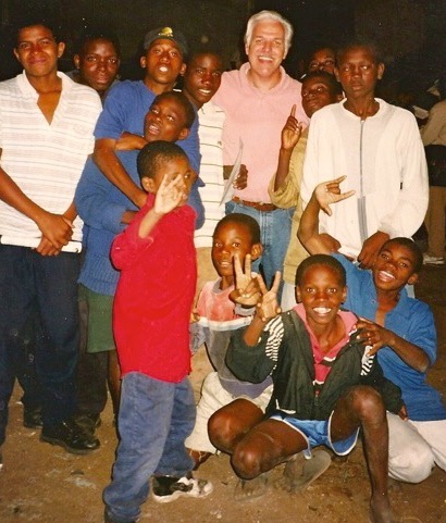 Rev. Steven A. Bach with a group of children on a mission trip in Africa