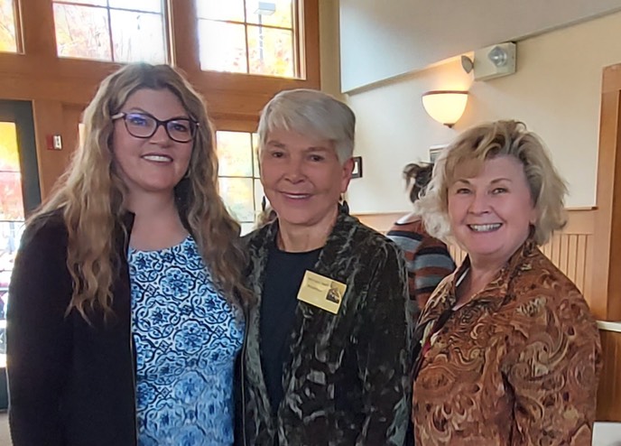 Lana Bach with two women at a widows ministry gathering
